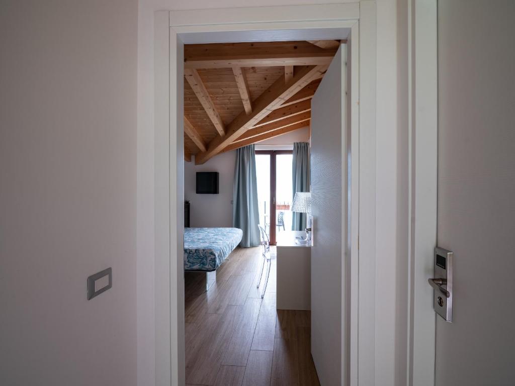 Postel nebo postele na pokoji v ubytování Foresteria Lago di Como