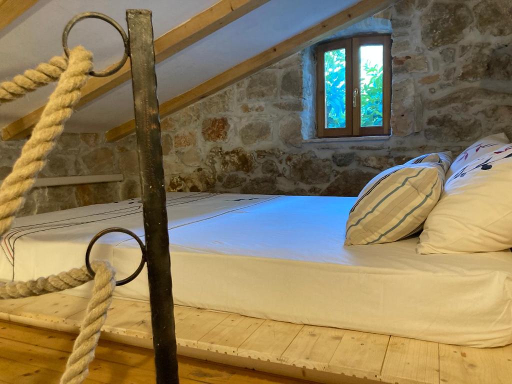 Postel nebo postele na pokoji v ubytování Il Melograno Vrbanj Hvar