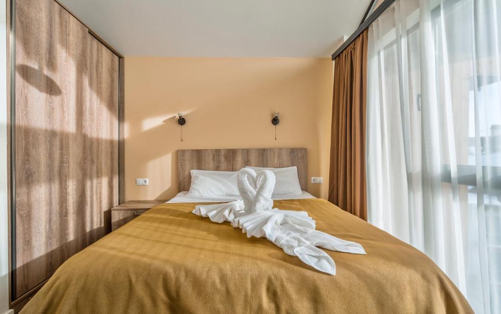 Postel nebo postele na pokoji v ubytování GVC 3-room 412 New Gudauri