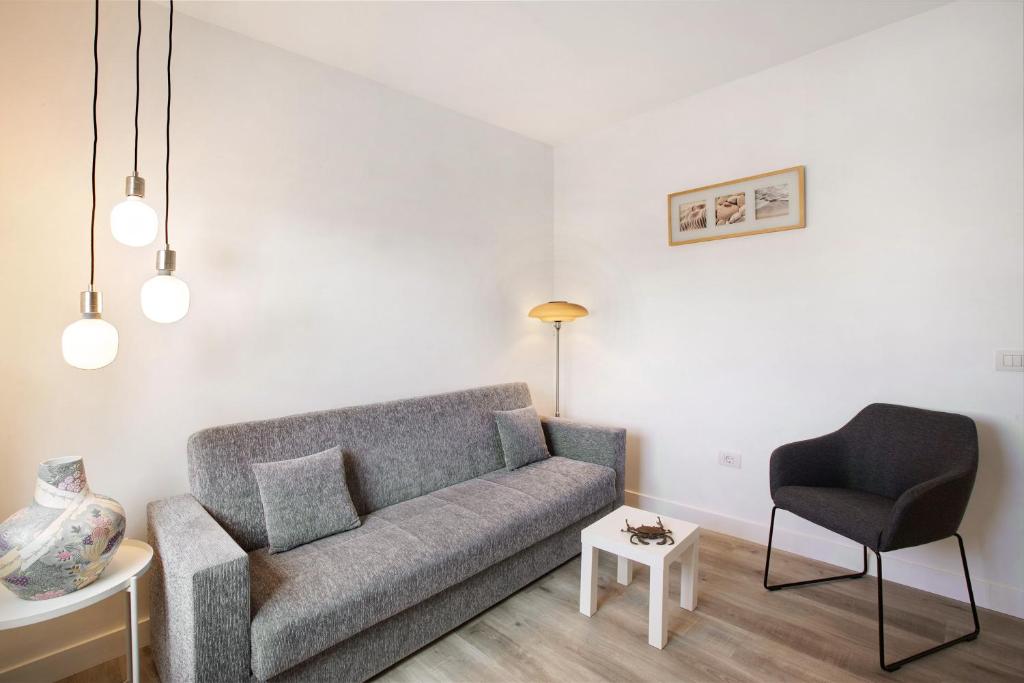 a living room with a couch and a chair at Eras Views in Las Eras