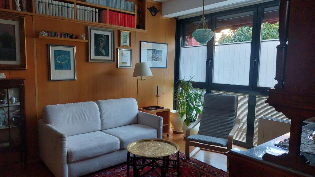 a living room with a couch and a chair at Il Girasole in Milan