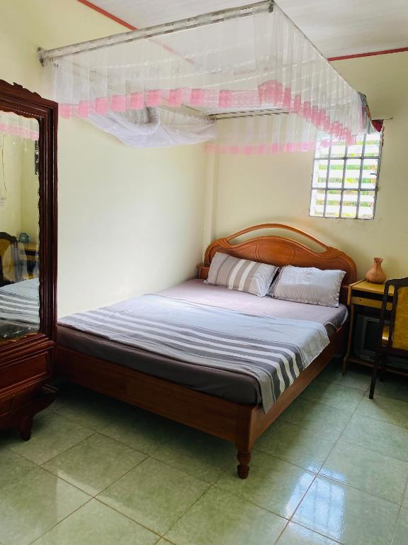 Postel nebo postele na pokoji v ubytování Bao Loc Homestay