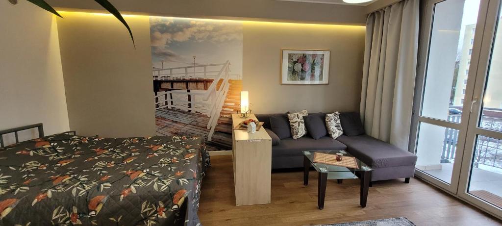 Posteľ alebo postele v izbe v ubytovaní Apartament na Heweliusza