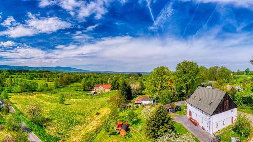 an aerial view of a farm with a white barn at Maja Pokoje z Widokiem in Mirsk