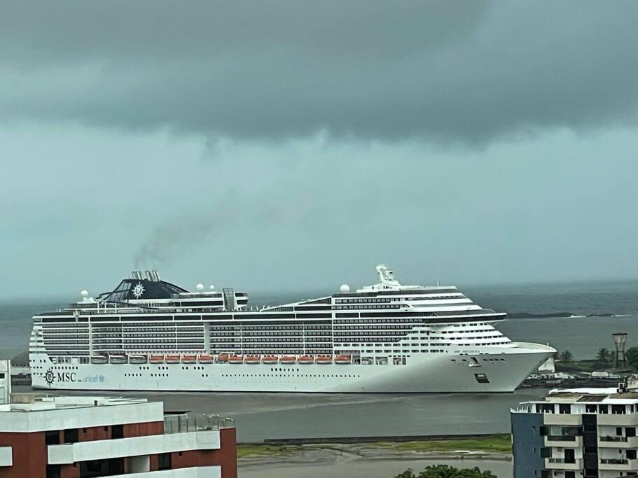 a cruise ship is docked in a harbor at Ampla, 180 graus de vista mar. in Ilhéus