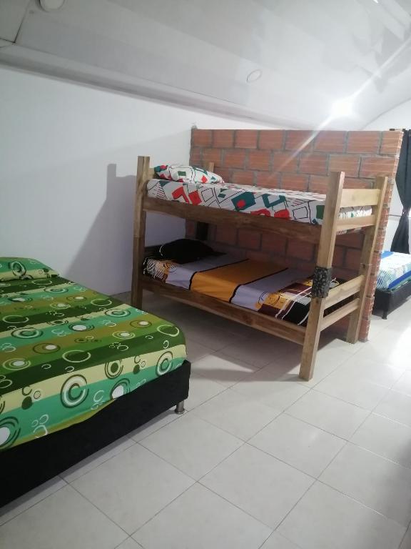 Postel nebo postele na pokoji v ubytování casa de relajación lowcost