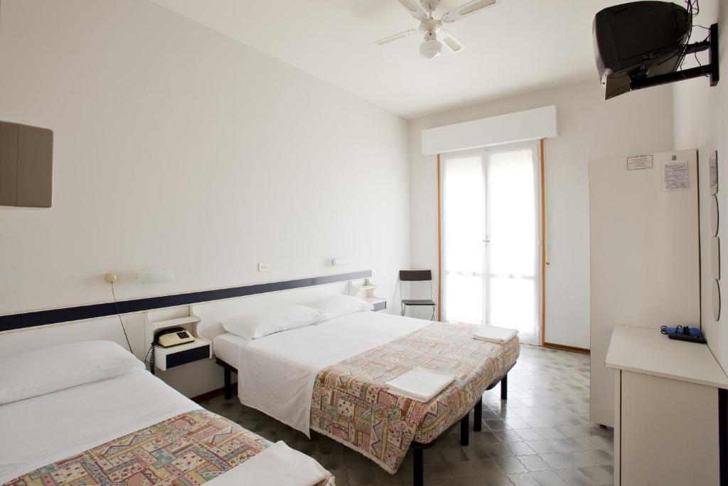 Postel nebo postele na pokoji v ubytování Hotel B&B Avana