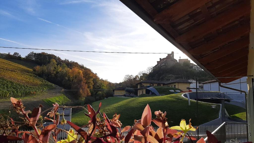 a view of a hill with a house in the background at Ciabot delle Aie - Barolo in Barolo