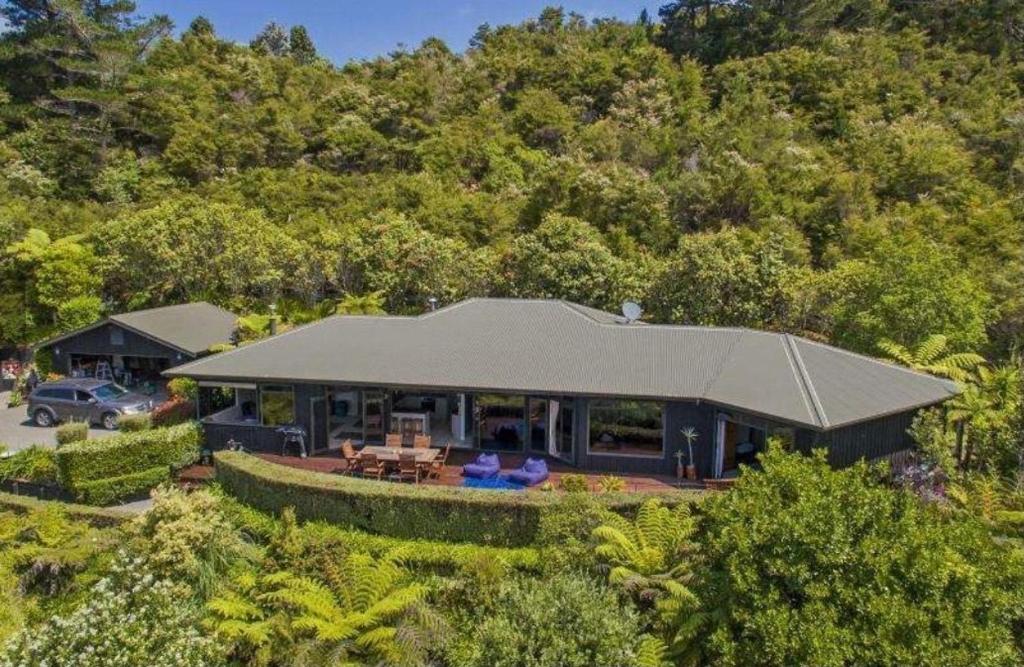 an aerial view of a house with a roof at TAIRUA SLICE OF PARADISE! in Tairua