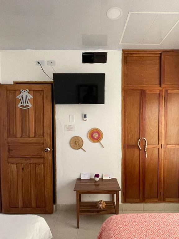 Una cama o camas en una habitación de Casa Inés Tolú