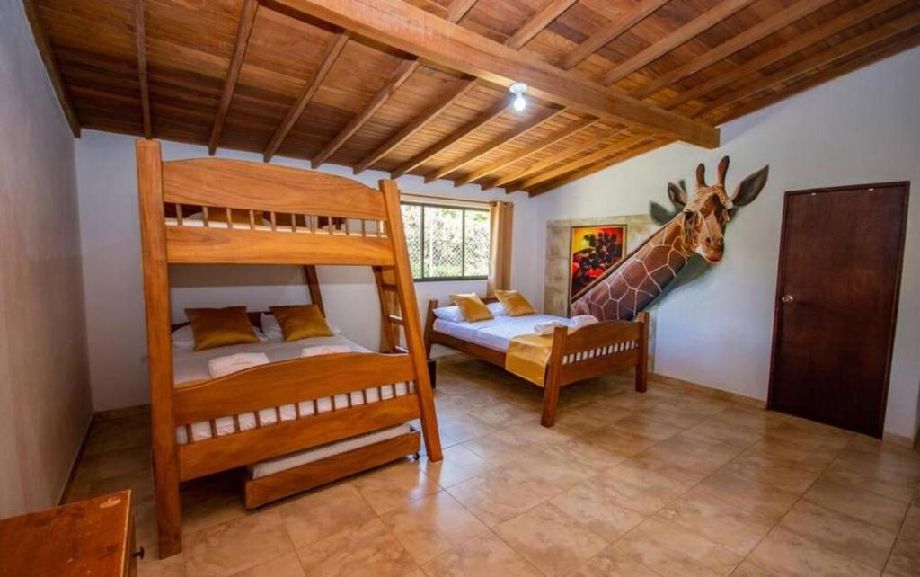 Postel nebo postele na pokoji v ubytování Hotel San Sebastian del Tonusco