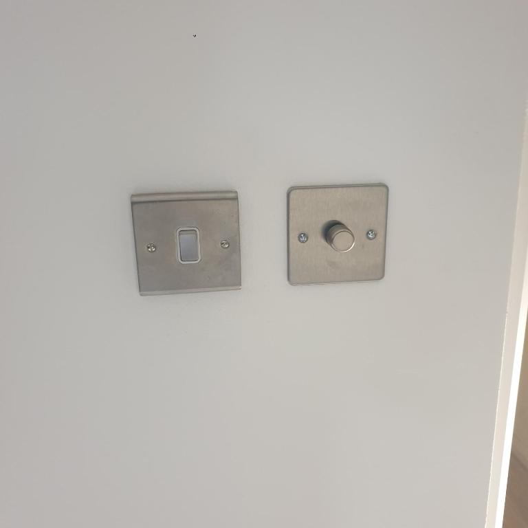 two electrical outlets on a white wall at Bakus Executive Suite in Abbey Wood