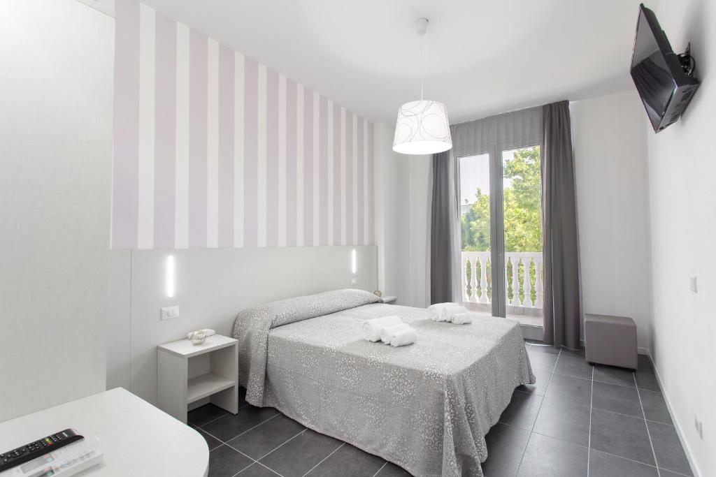 Postel nebo postele na pokoji v ubytování Hotel Star