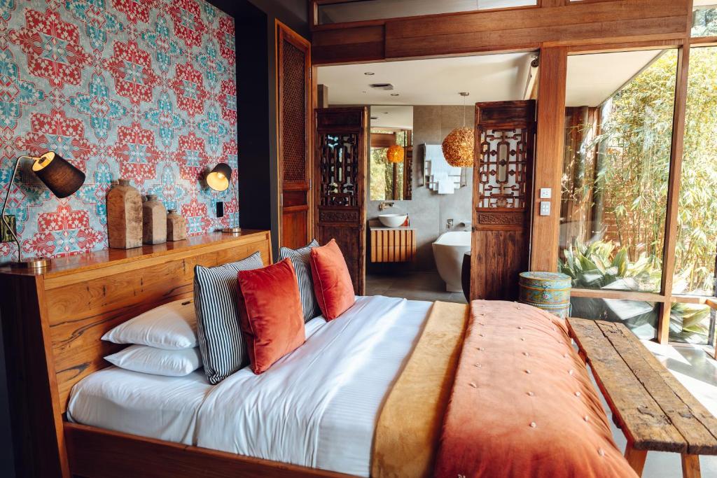 Postel nebo postele na pokoji v ubytování Sticky Rice Villas