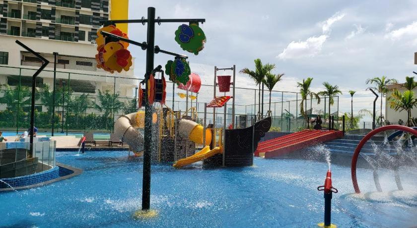 a water park with a playground with a slide at SuteraMuslimHomestay Bali Residence Melaka in Melaka