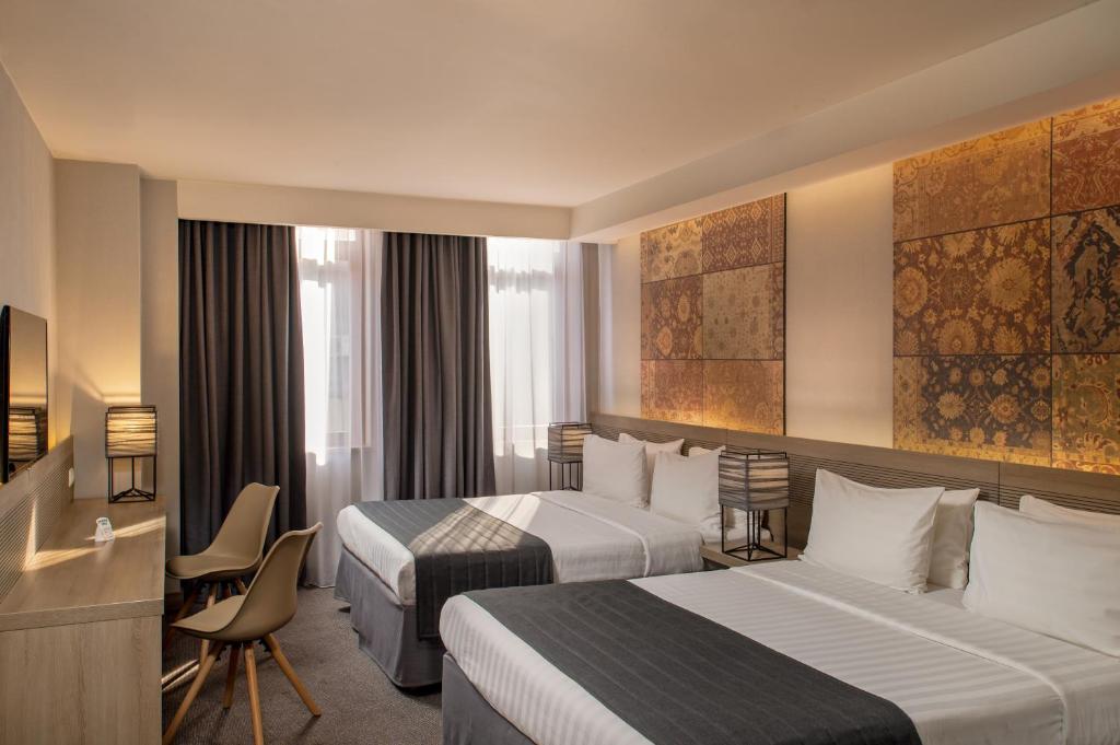 Postel nebo postele na pokoji v ubytování Republica Hotel Yerevan