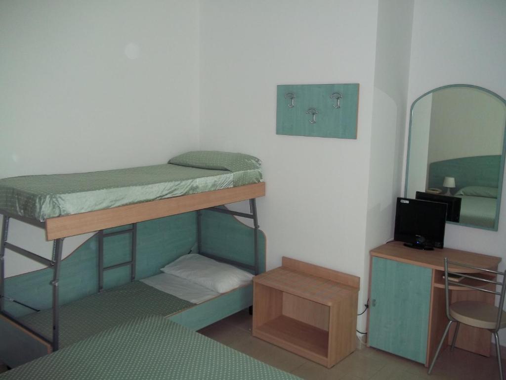 Postel nebo postele na pokoji v ubytování Hotel Rivabella