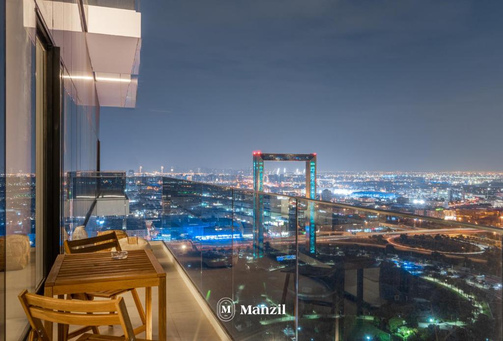 a room with a view of a city at night at Manzil - 2BR Apt in Al Wasl Residences with Park View, Dubai Trade Center in Dubai