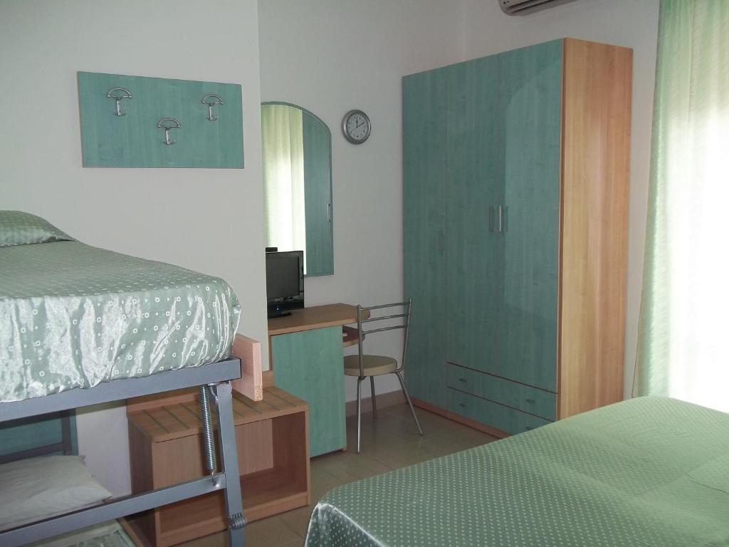Postel nebo postele na pokoji v ubytování Hotel Rivabella