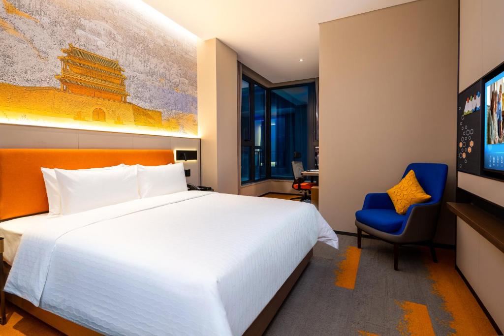 Postel nebo postele na pokoji v ubytování Hampton by Hilton Beijing West Railway Station Lize Business District