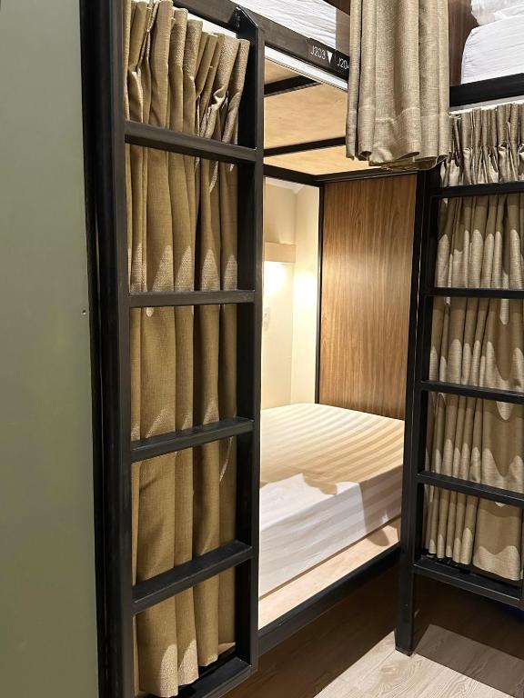 Postel nebo postele na pokoji v ubytování Jiran Hostel Kota Kinabalu