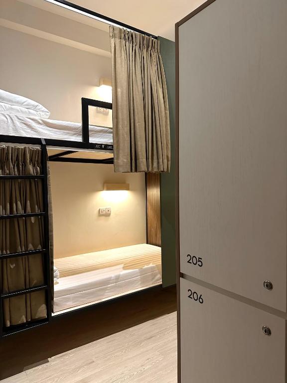 Postel nebo postele na pokoji v ubytování Jiran Hostel Kota Kinabalu