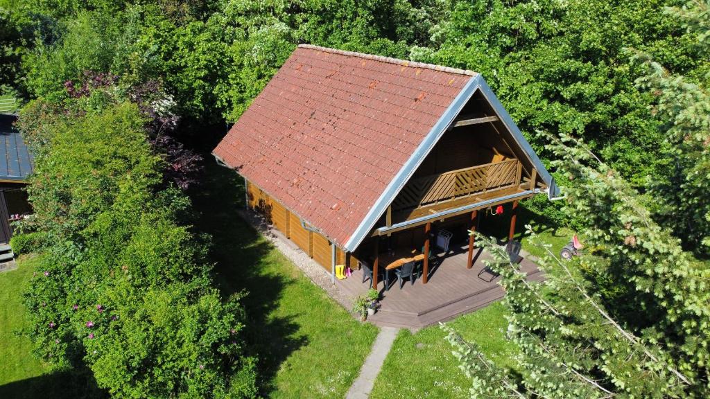 an overhead view of a house with a red roof at Ulmenhof Melfsen in Oeversee