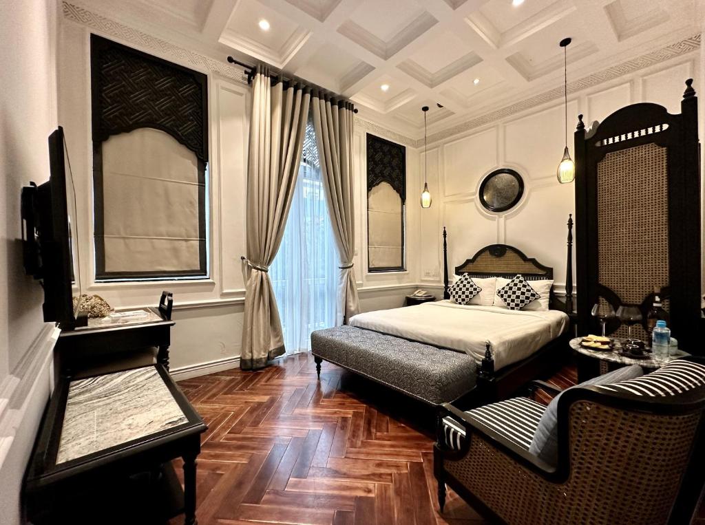 Postel nebo postele na pokoji v ubytování Hanoi Graceful Hotel and Travel