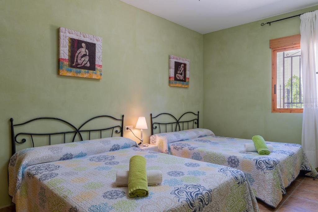 Postel nebo postele na pokoji v ubytování CASA RURAL C PUENTE DEL SEGURA