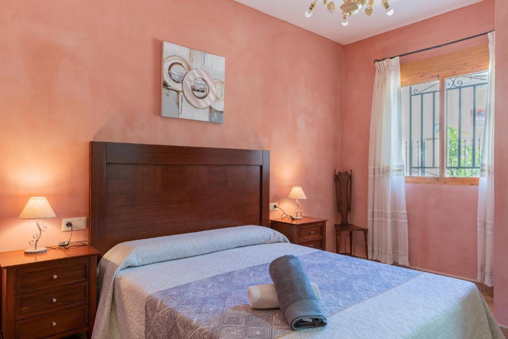 Postel nebo postele na pokoji v ubytování CASA RURAL C PUENTE DEL SEGURA
