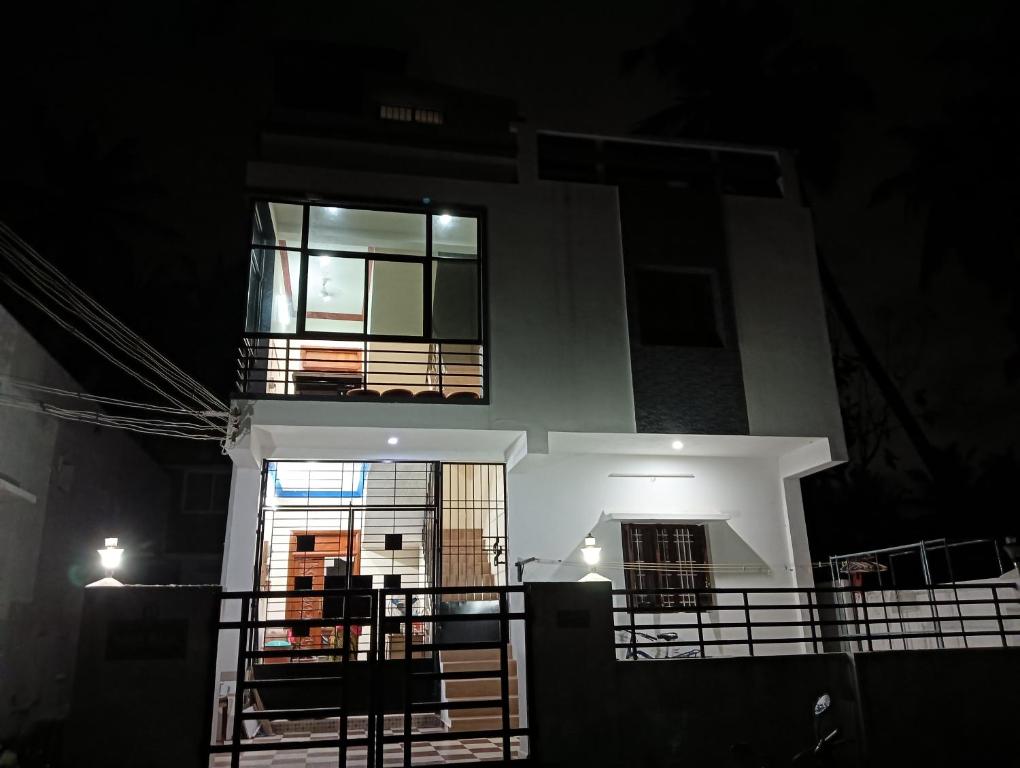 a building with two windows on top of it at night at Rose Villa in Puducherry