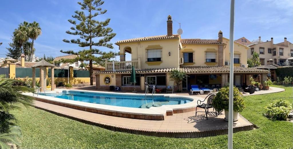 a house with a swimming pool in the yard at Casa Beatriz V in Rincón de la Victoria