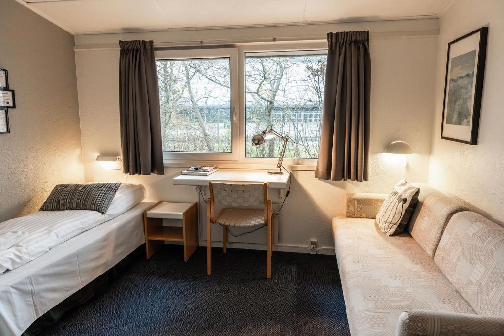 Postel nebo postele na pokoji v ubytování Hotel Herning