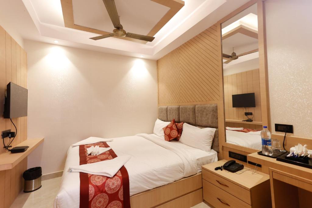 Postel nebo postele na pokoji v ubytování Hotel Sarc Inn
