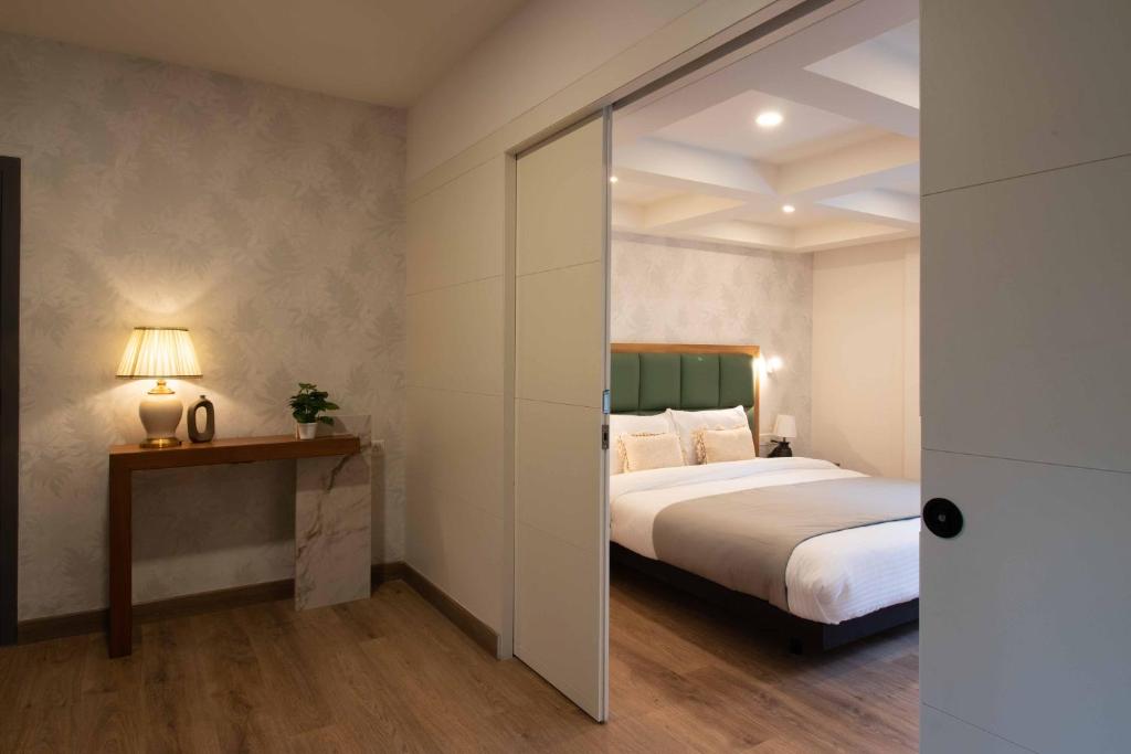 Postel nebo postele na pokoji v ubytování HOTEL LE ROYCE
