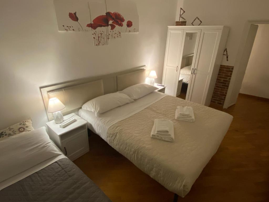 Łóżko lub łóżka w pokoju w obiekcie Casa Della Rovere