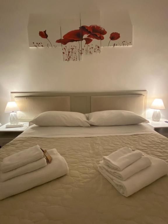Łóżko lub łóżka w pokoju w obiekcie Casa Della Rovere
