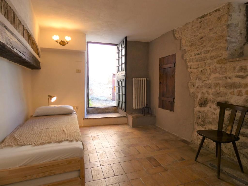Postel nebo postele na pokoji v ubytování Scappo in Umbria, L'affaccio
