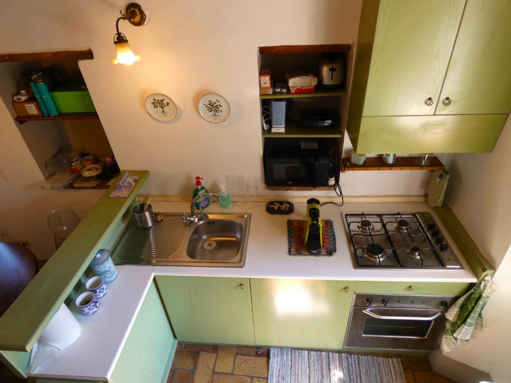 Kuchyň nebo kuchyňský kout v ubytování Scappo in Umbria, L'affaccio