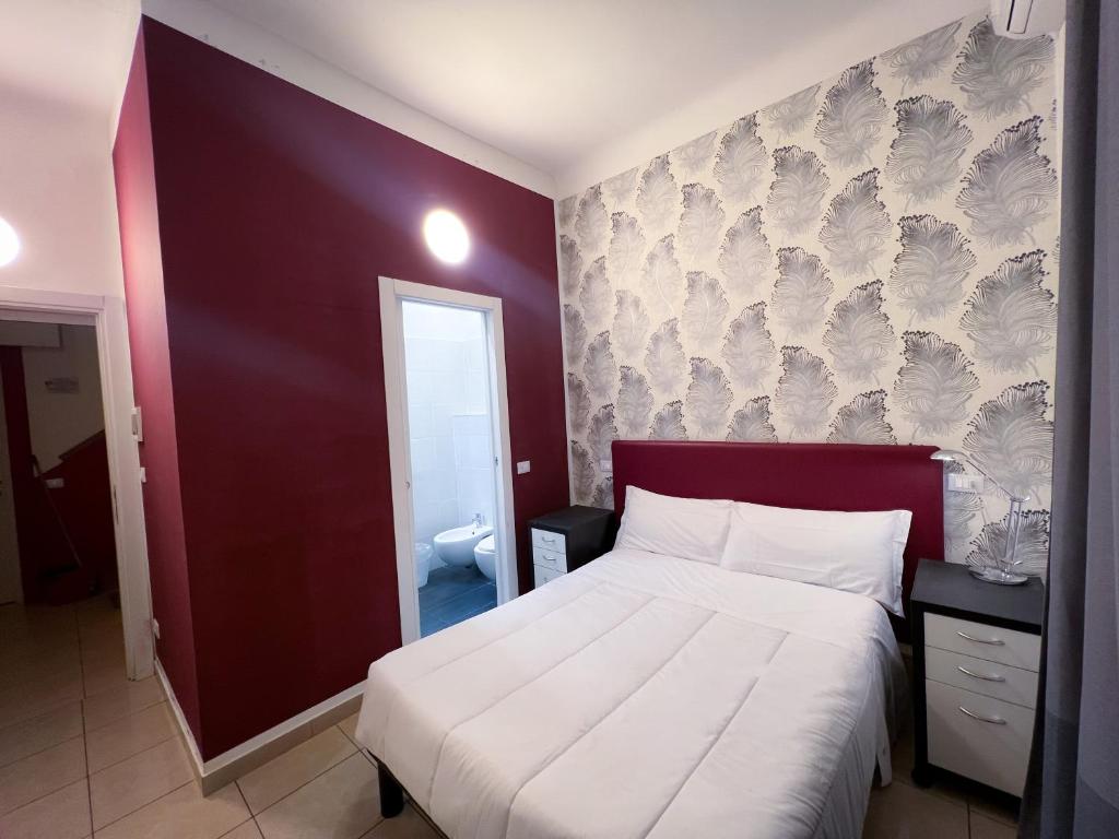Llit o llits en una habitació de Hotel RossoVino Milano