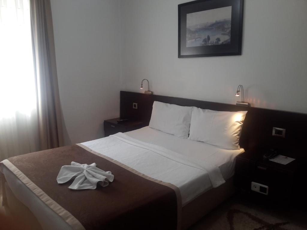 Łóżko lub łóżka w pokoju w obiekcie Hotel Residence