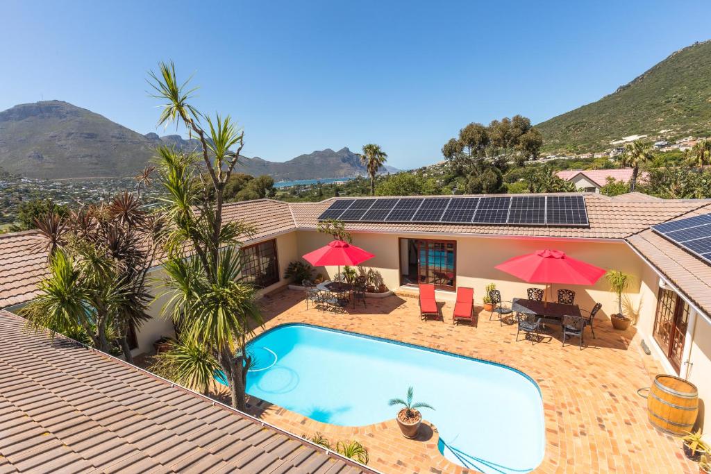 an image of a house with a swimming pool at Hout Bay Lodge in Hout Bay