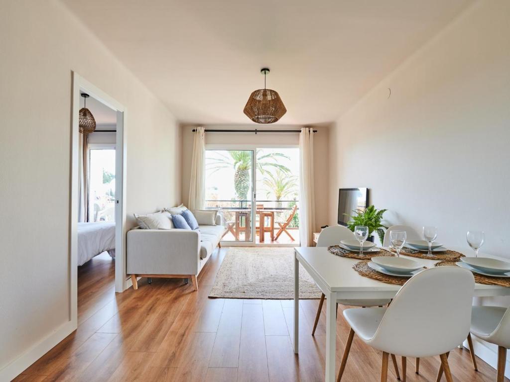 a living room with a white table and chairs at 0326 Apartment in Calella de Palafrugell in Calella de Palafrugell