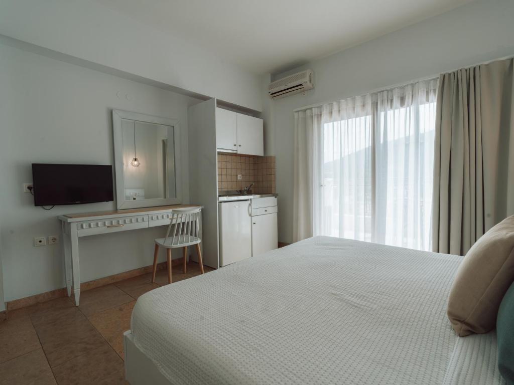 TV a/nebo společenská místnost v ubytování Dracos Hotel