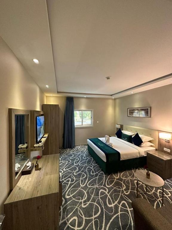 Postel nebo postele na pokoji v ubytování Sunrise Suites