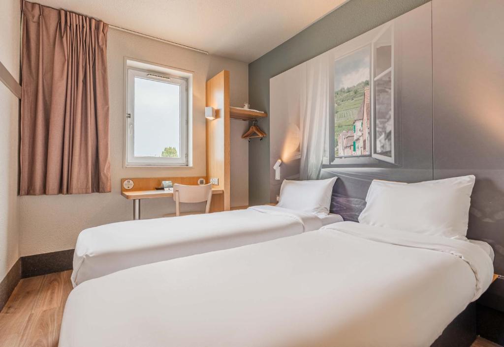 Postel nebo postele na pokoji v ubytování B&B HOTEL Mulhouse Ile Napoléon