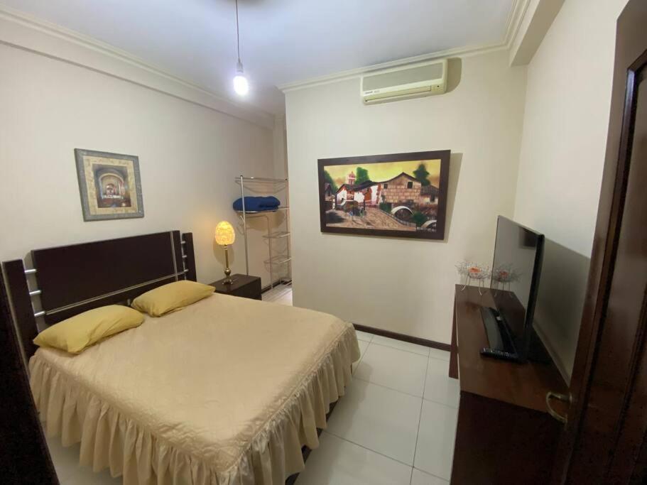a bedroom with a bed and a television in it at Departamento de 2 habitaciones in Santa Cruz de la Sierra