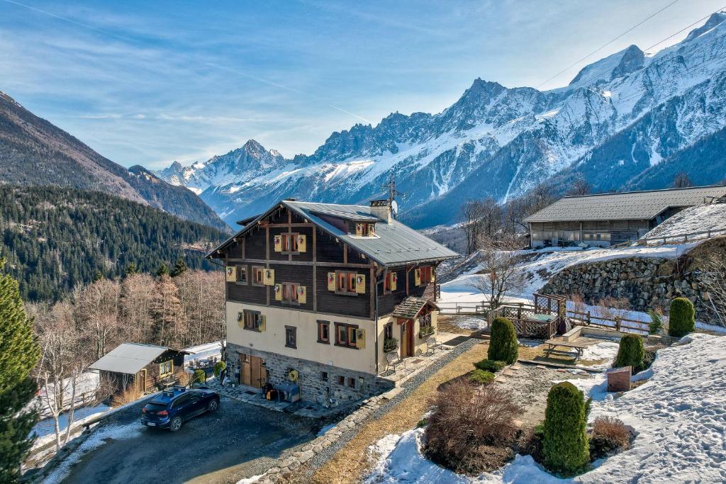 an aerial view of a house in the mountains at Maison Jaune, Alpes Travel, Ski in Ski Out, Sleeps 10 in Les Houches
