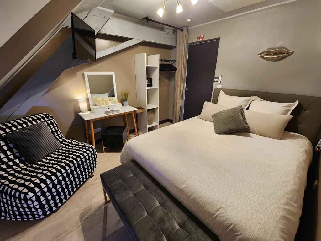Tempat tidur dalam kamar di Le Domaine du Templier - Chapelain