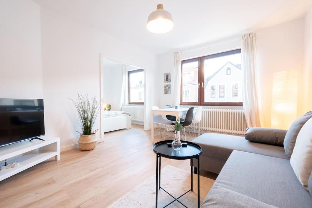 a living room with a couch and a table at Exklusive 2-Zimmer Wohnung für 6 in Bremen